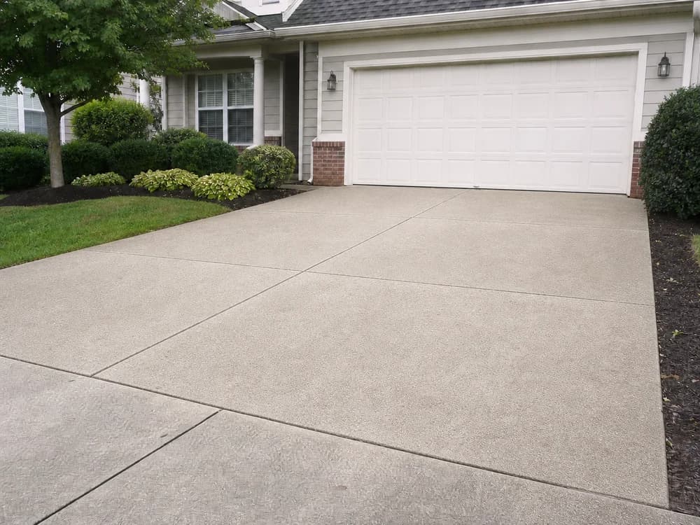The same driveway clean after pressure washing